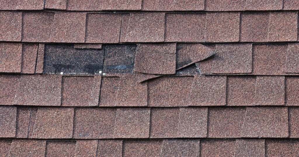 Missing roof shingles.