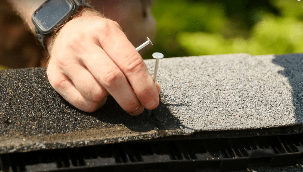How to Properly Ventilate a Flat Roof 1 Man installing a ridge vent
